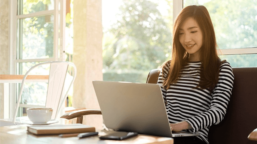 A person attending a webinar or online course, symbolizing continuous learning and adaptation.