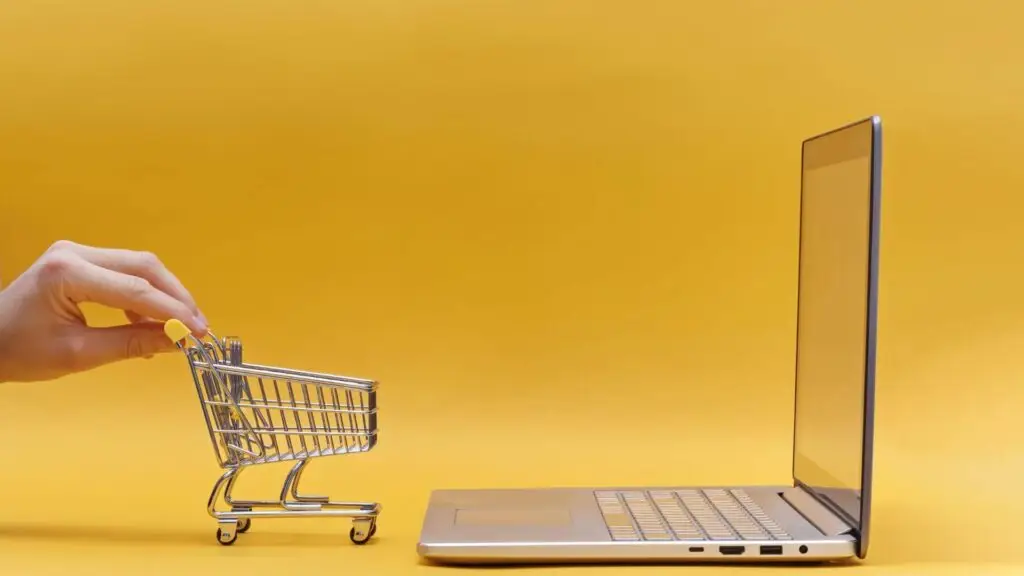 a laptop and a shopping cart, 10 Expert-Recommended e-commerce quick fixes quick fixes to Elevate Your Business Revenue